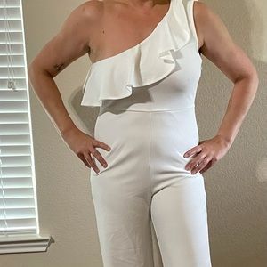 One shoulder white jumpsuit.